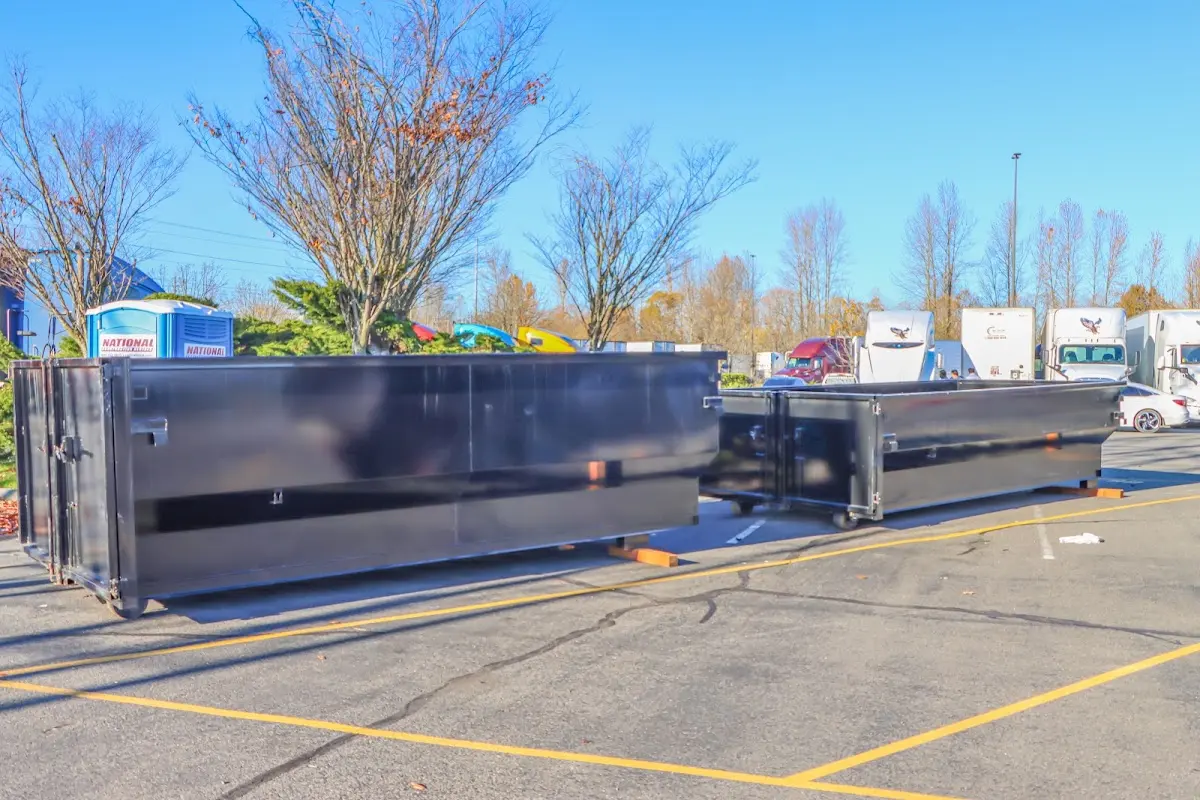 Professional dumpster rental service with roll-off container on residential driveway in Rancho Palos Verdes